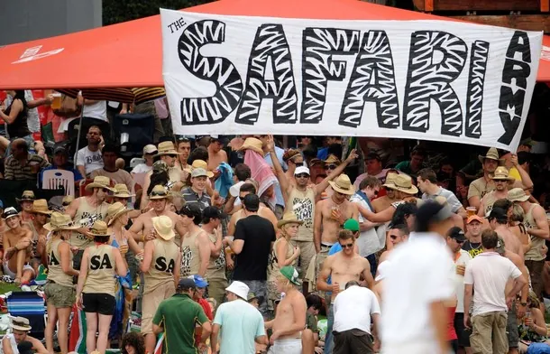 The hand-painted zebra-striped Safari Army banner held above the crowd